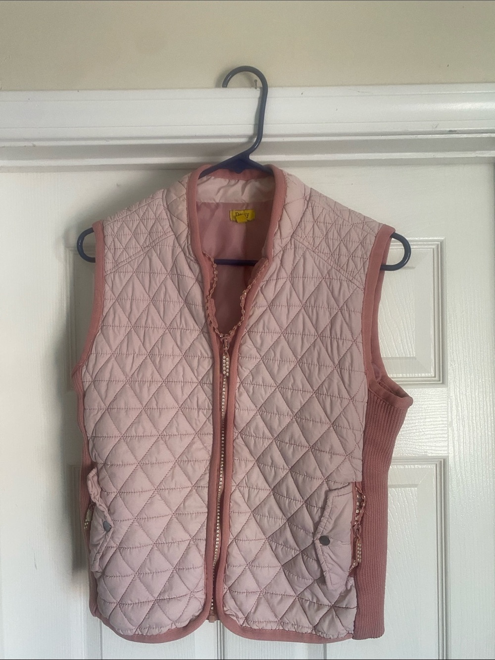 Quilted Pink Sleeveless Vest with Rib  sides with rhinestone on zipper.
